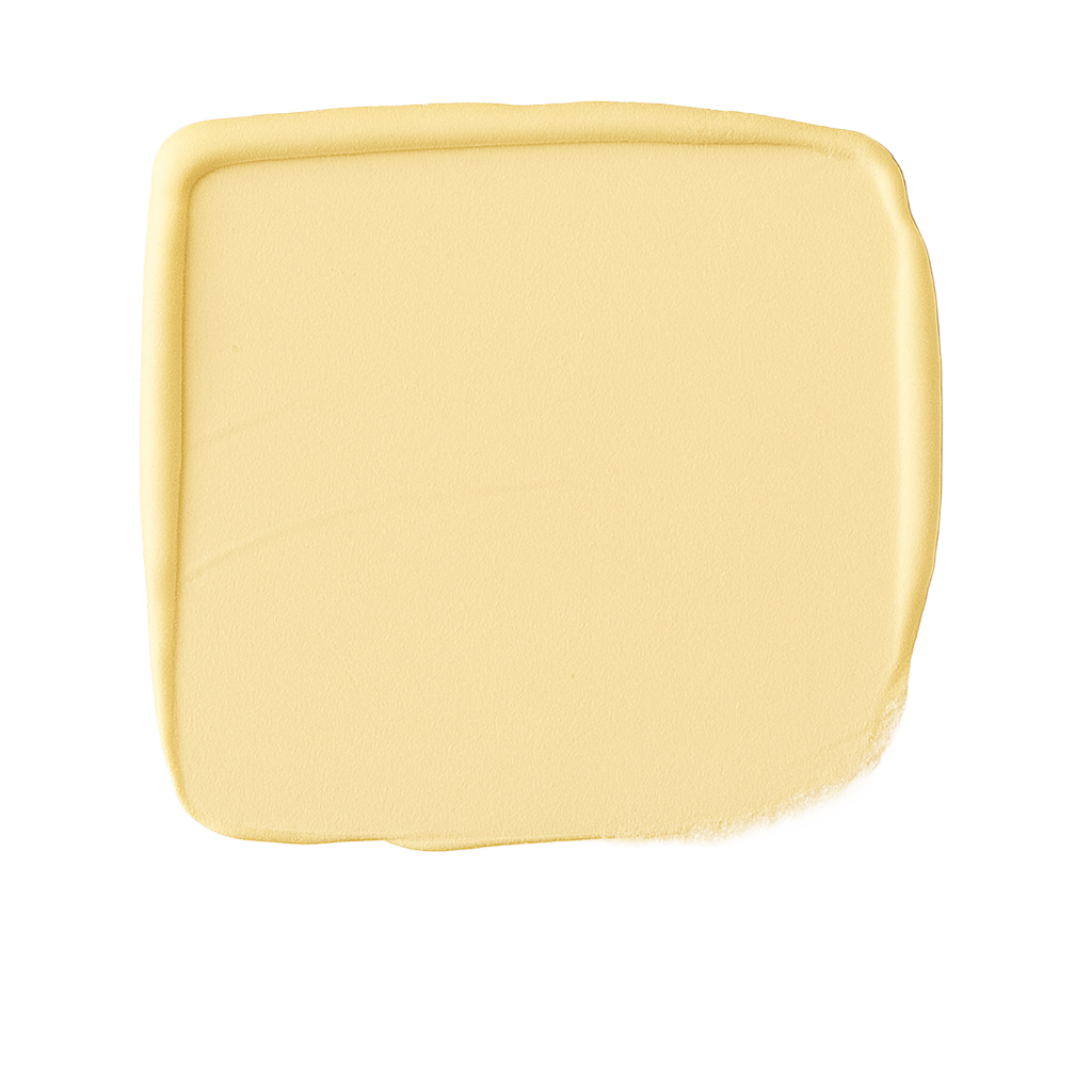 Square piece of light yellow soap on a white background.