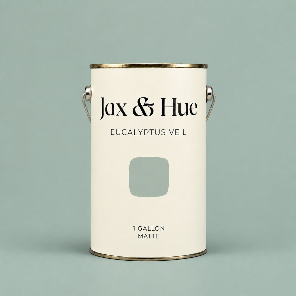 Jax & Hue Eucalyptus Veil soft sage green matte paint gallon on a matching pale green background.
