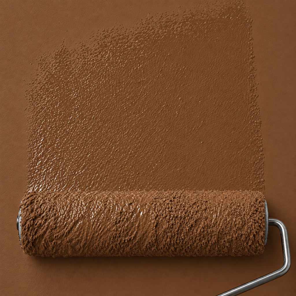 Roller applying Bridle Clay deep earthy brown matte paint to a wall, showing the rich reddish brown color and fresh paint texture.