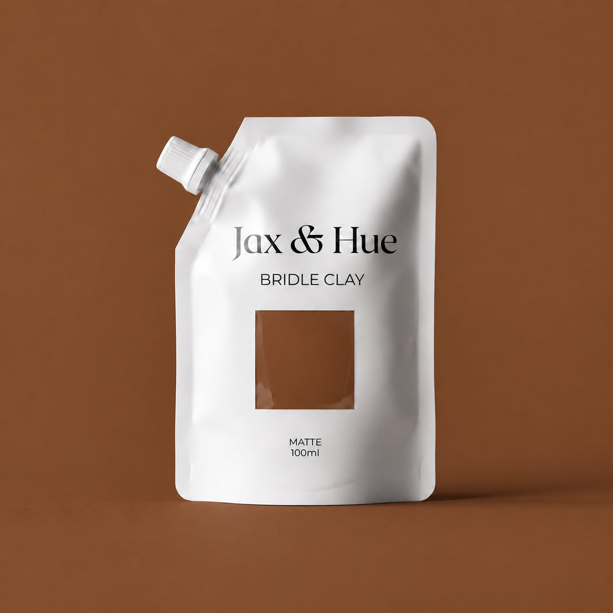 Jax & Hue Bridle Clay 100 ml Color Tester pouch showing a deep reddish brown matte interior paint color.