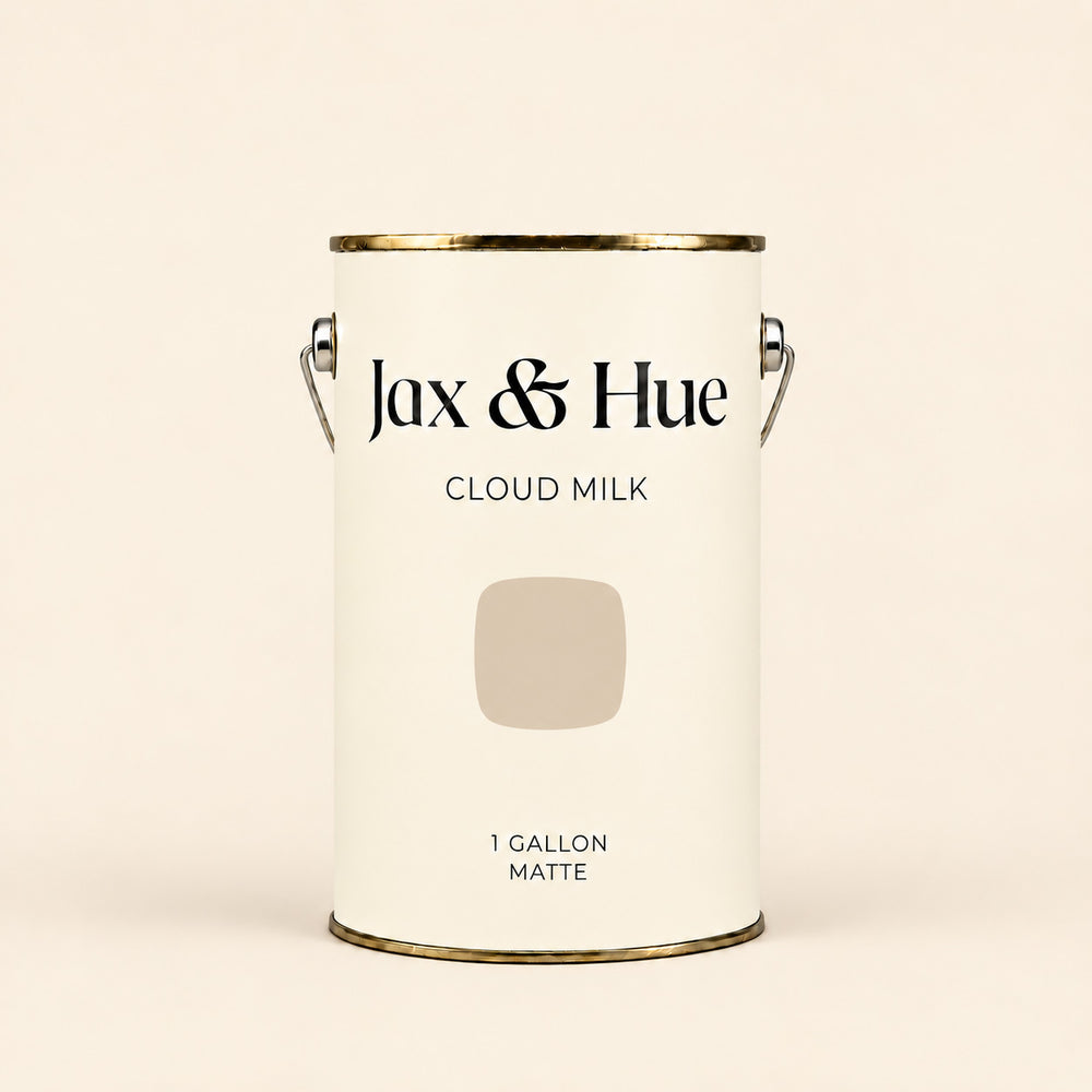 Jax & Hue Cloud Milk soft warm white matte paint gallon on a matching off-white background.