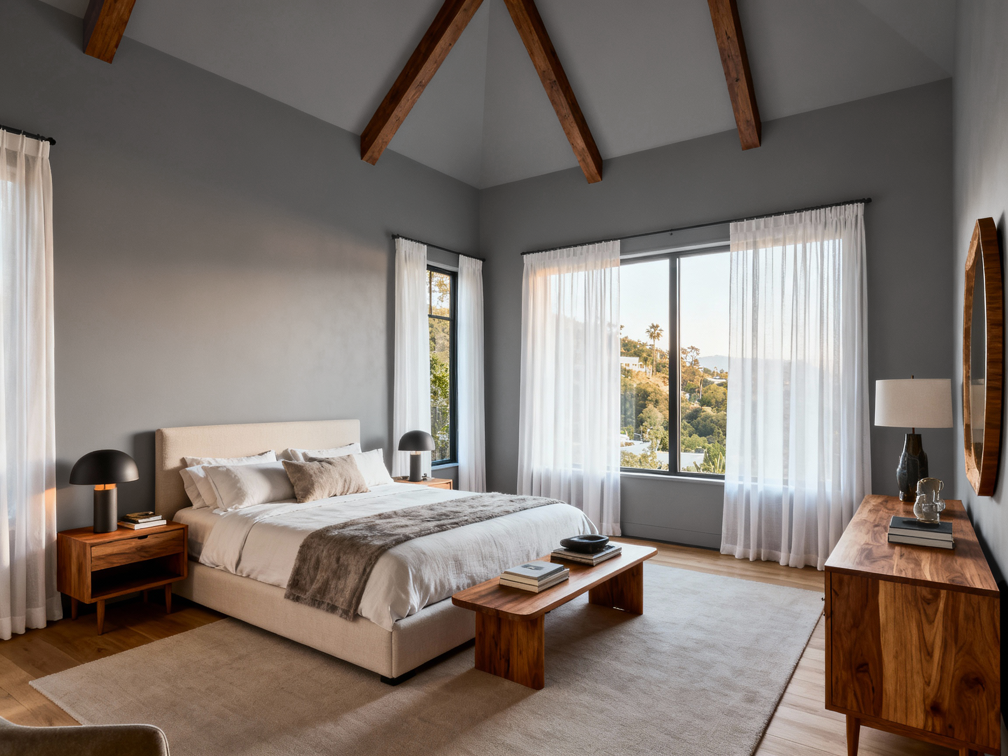 Modern bedroom with gray walls, wooden furniture, and large windows.