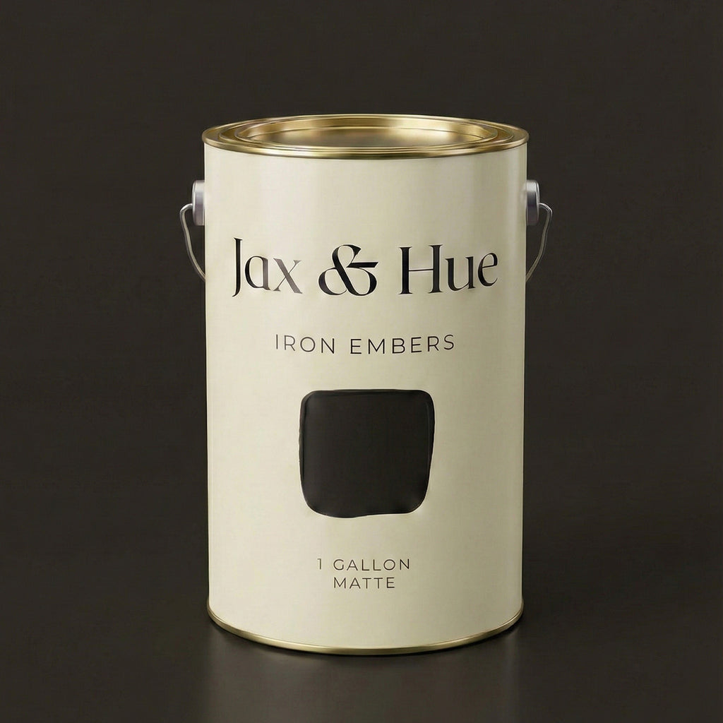 Jax & Hue Iron Embers paint can, a moody brown-black with warm molten undertones for dramatic spaces.