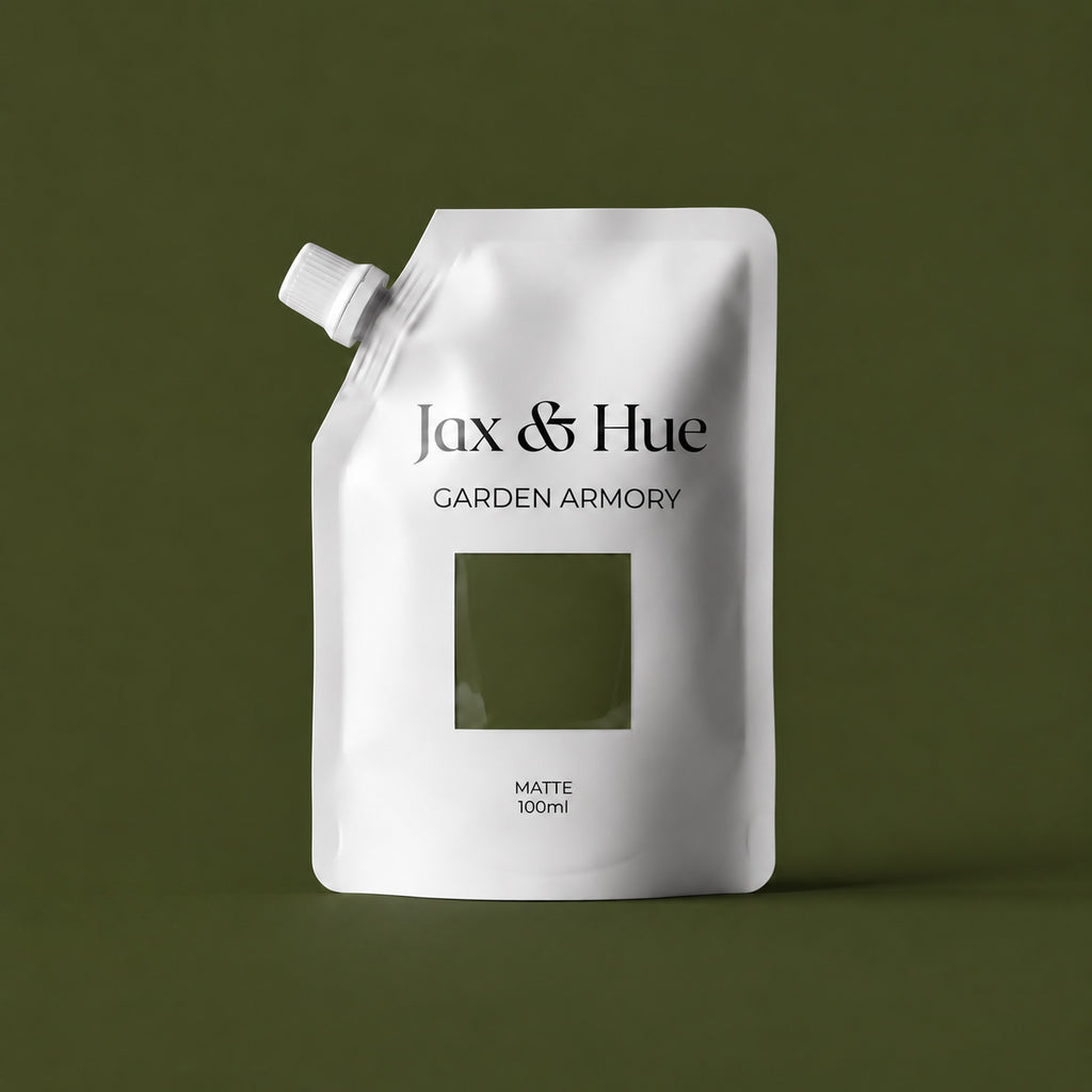 Jax & Hue Garden Armory 100ml dark olive green paint tester pouch against a matching green background.