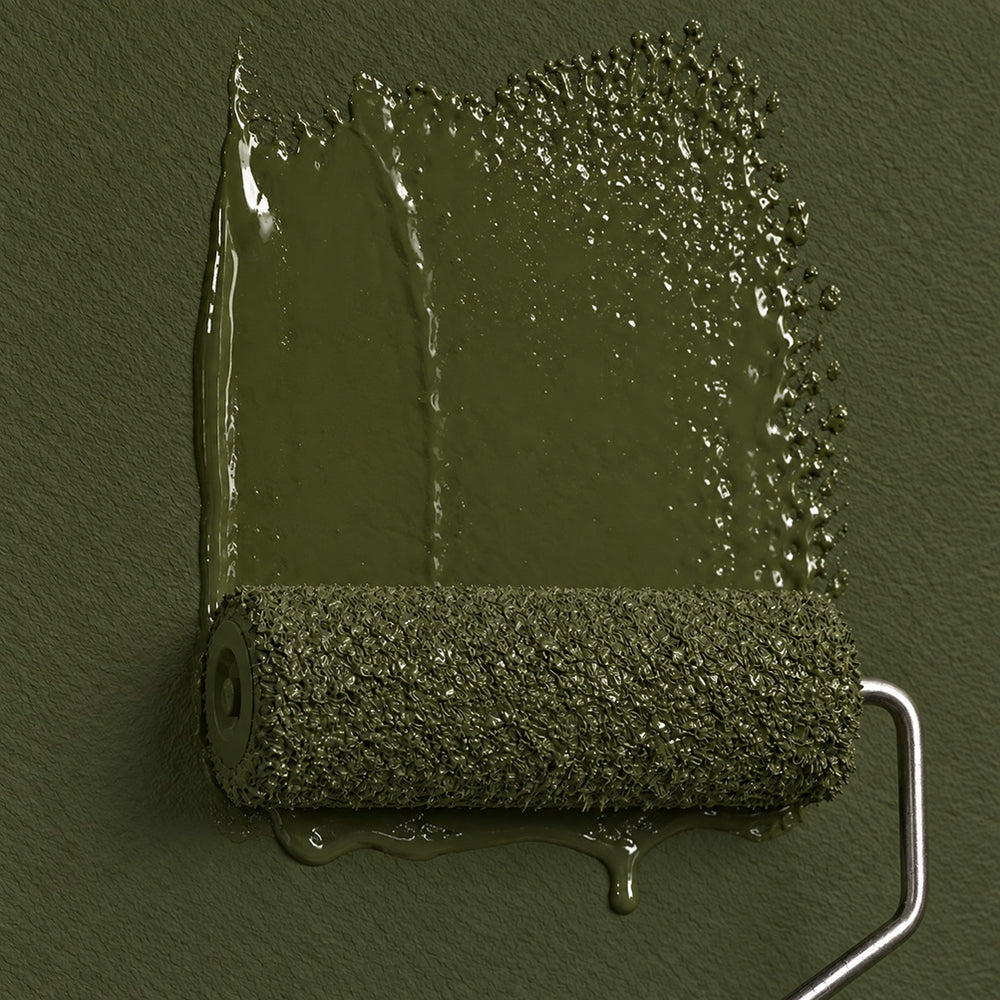 Roller applying Garden Armory dark olive green paint to a textured wall, showing fresh paint marks and drips.