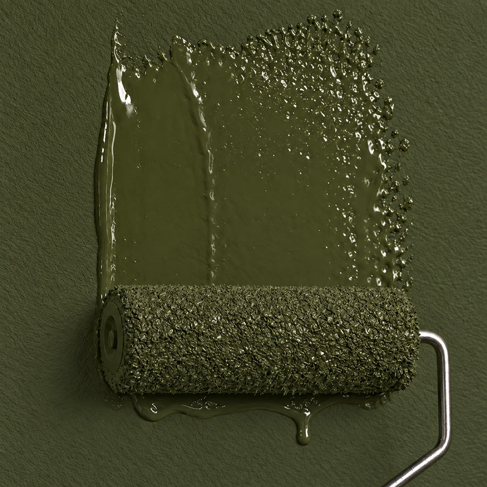 Roller applying Garden Armory dark olive green paint to a textured wall, showing fresh paint marks and drips.