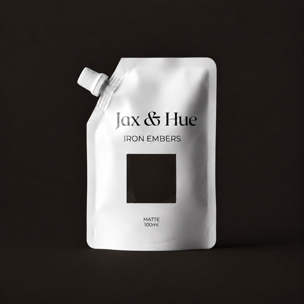 Iron Embers Color Tester pouch with a warm brown-black paint window and matching background.