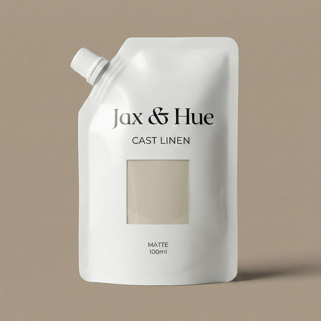 White bottle of Jax & Hue Cast Linen on a beige background