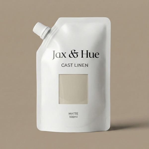 White bottle of Jax & Hue Cast Linen on a beige background