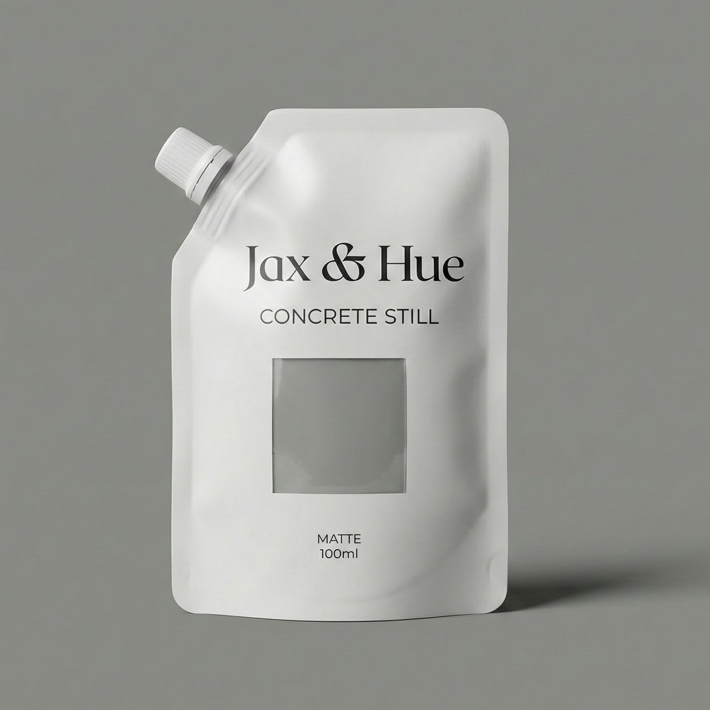 White pouch with 'Jax & Hue Concrete Still' branding on a gray background