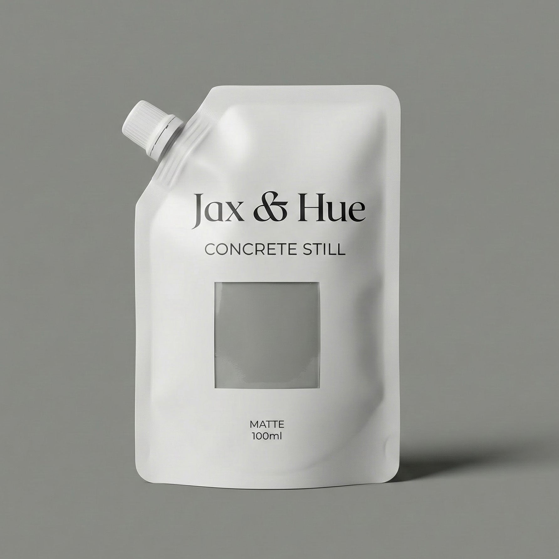 White pouch with 'Jax & Hue Concrete Still' branding on a gray background