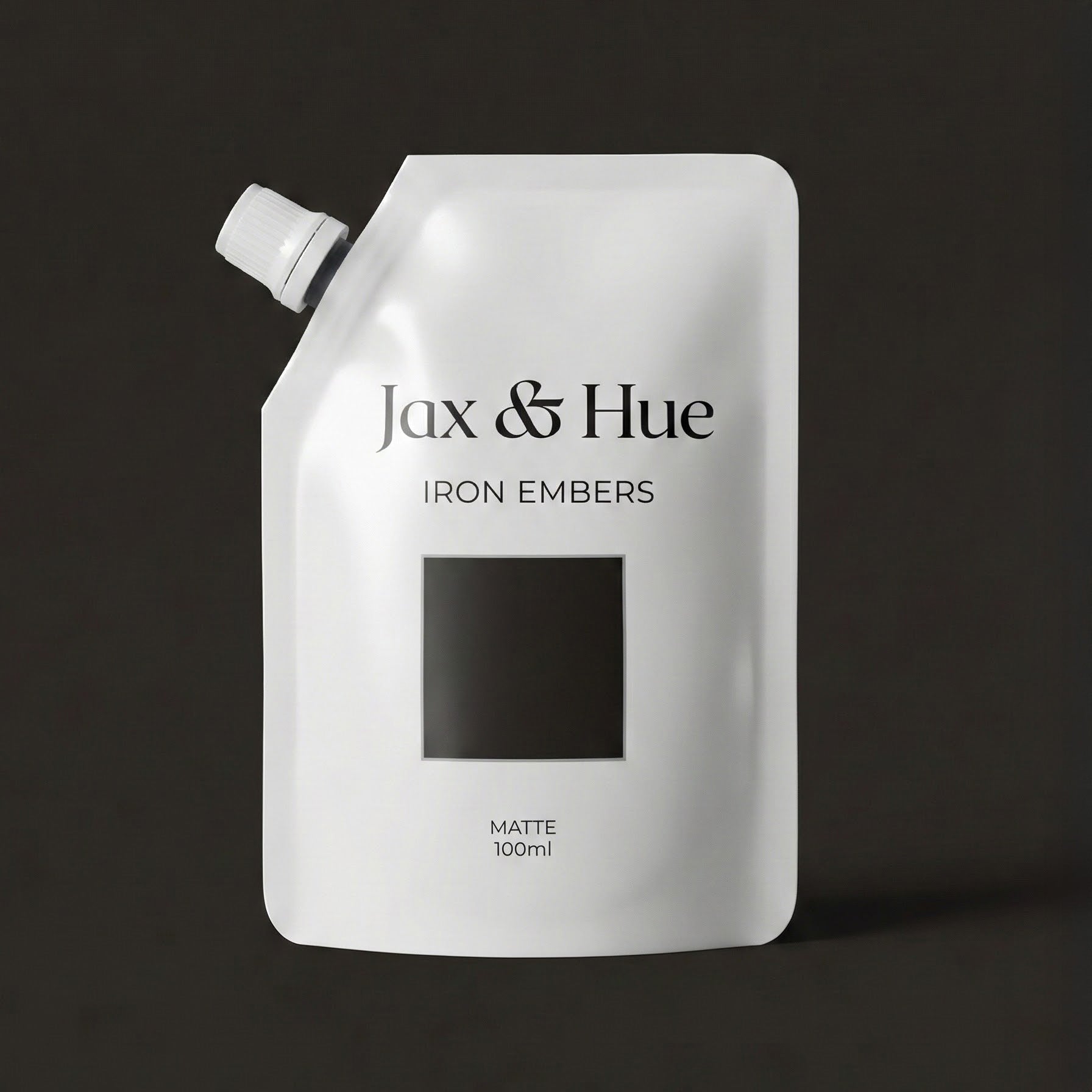Jax & Hue product packaging with 'Iron Embers' on a dark background