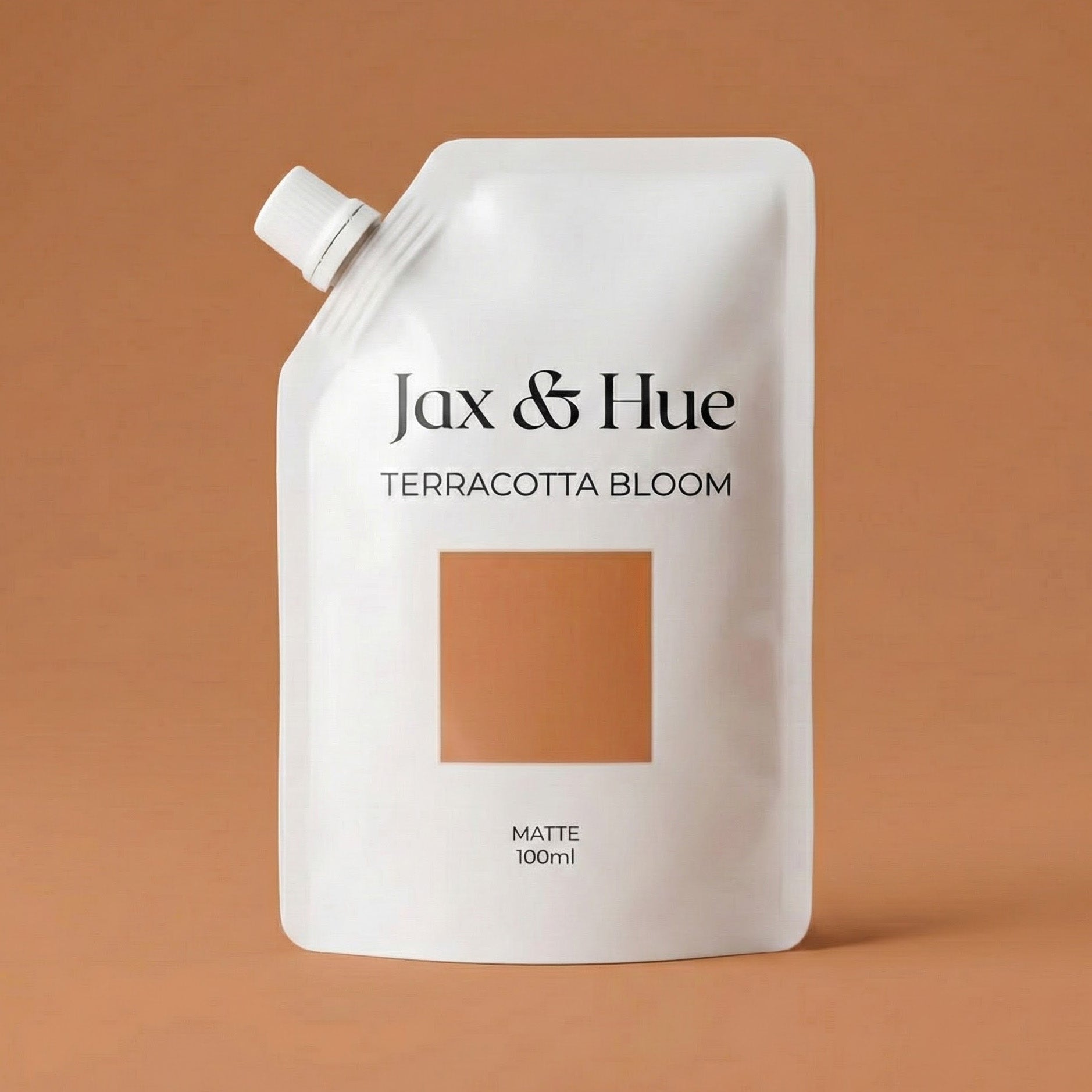 Jax & Hue Terracotta Bloom paint pouch on a brown background