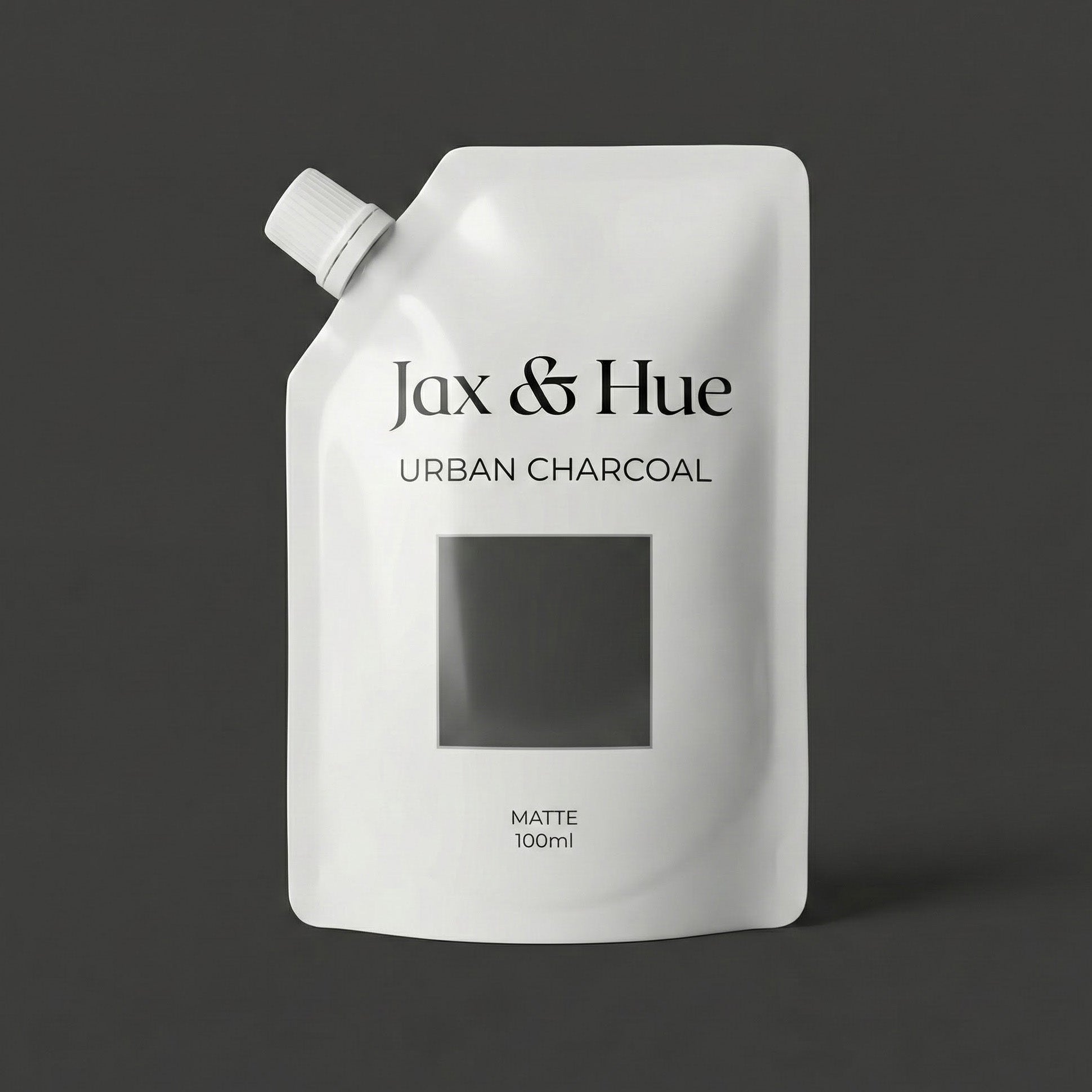 Jax & Hue Urban Charcoal packaging on a dark background