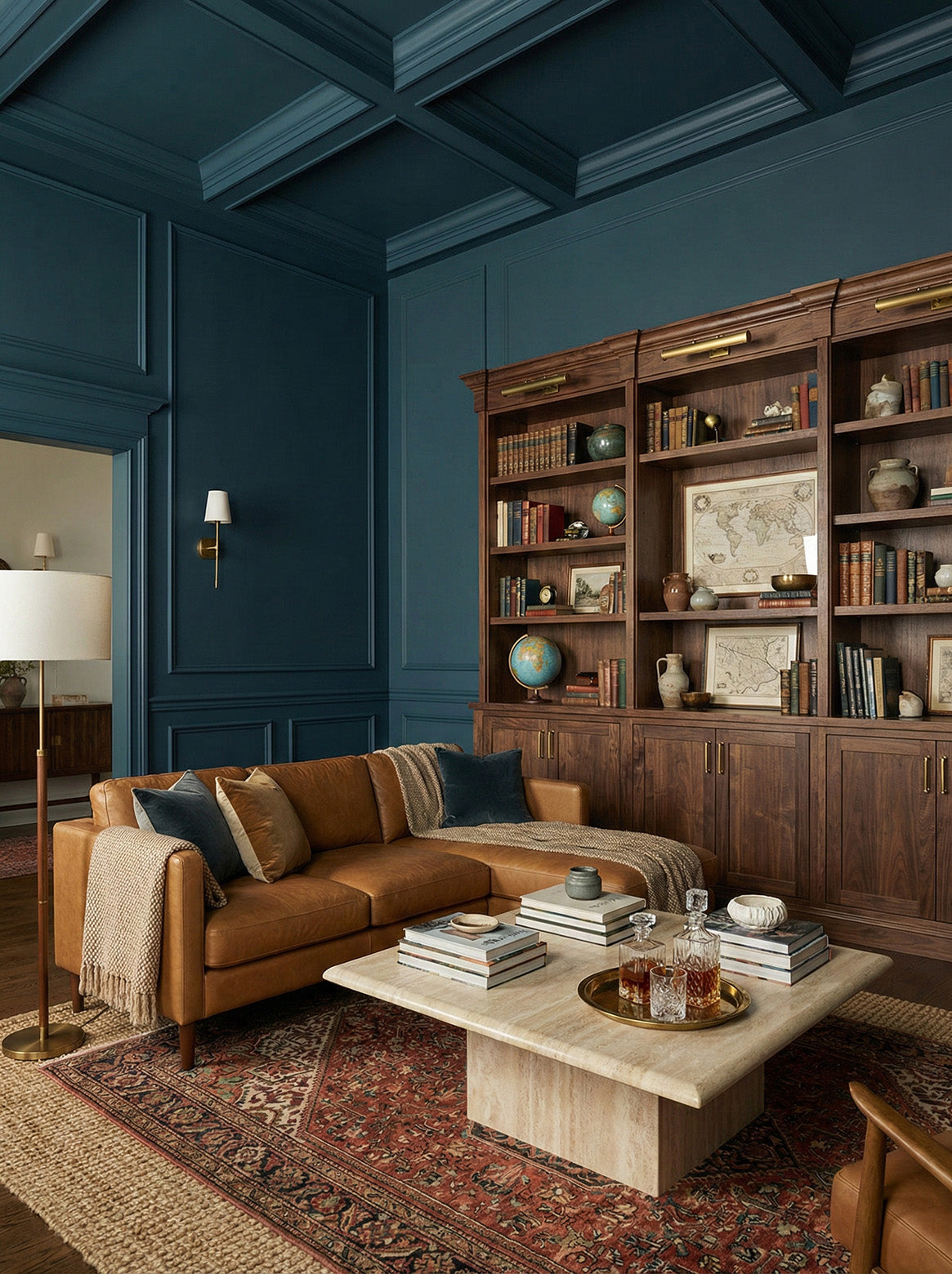 Cozy living room with brown sofa, wooden coffee table, and bookshelf against a blue wall.