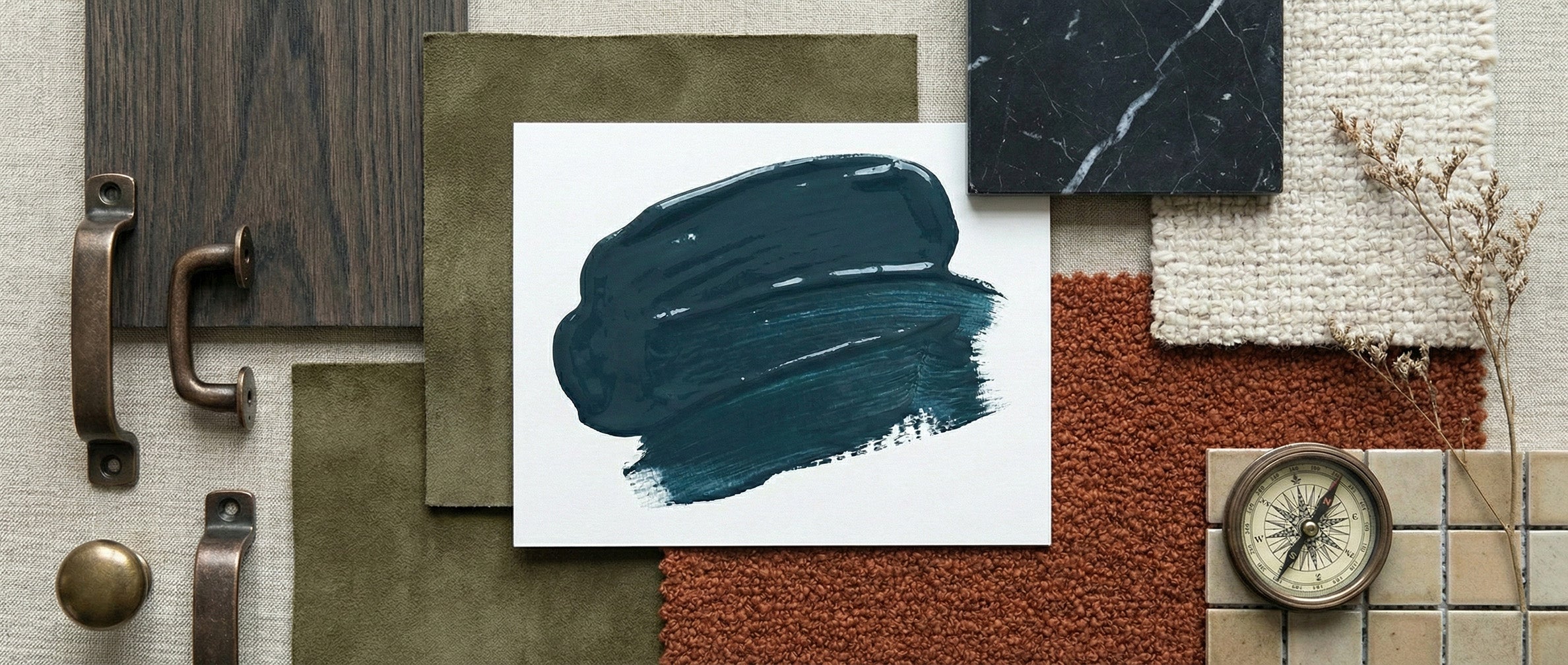 Collage of textures and colors with a blue paint swatch on a white card.