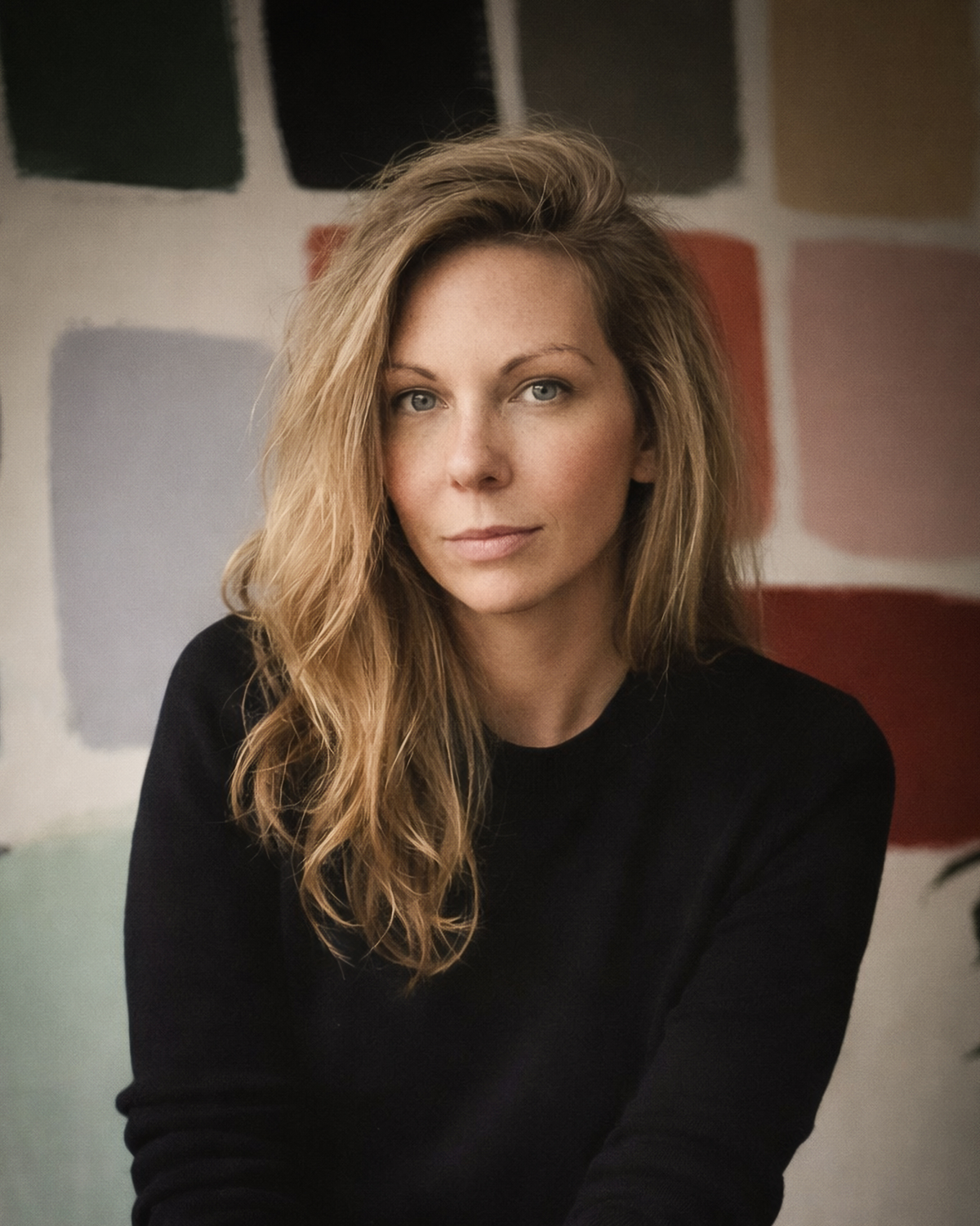 Portrait of Jax & Hue founder Holly Jackson among the brand’s color studies