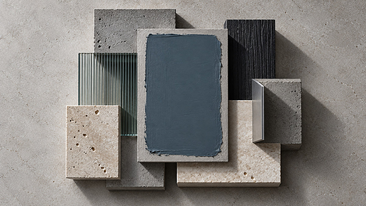 Tempest Slate blue-gray paint sample layered with pale stone, concrete, dark wood, and metal finishes