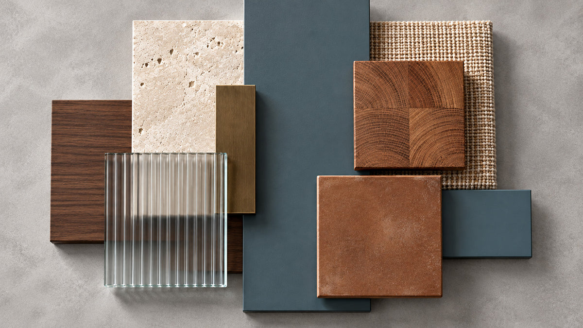 Tempest Slate slate blue-gray painted panels paired with warm wood, cream stone, ribbed glass, and terracotta tile