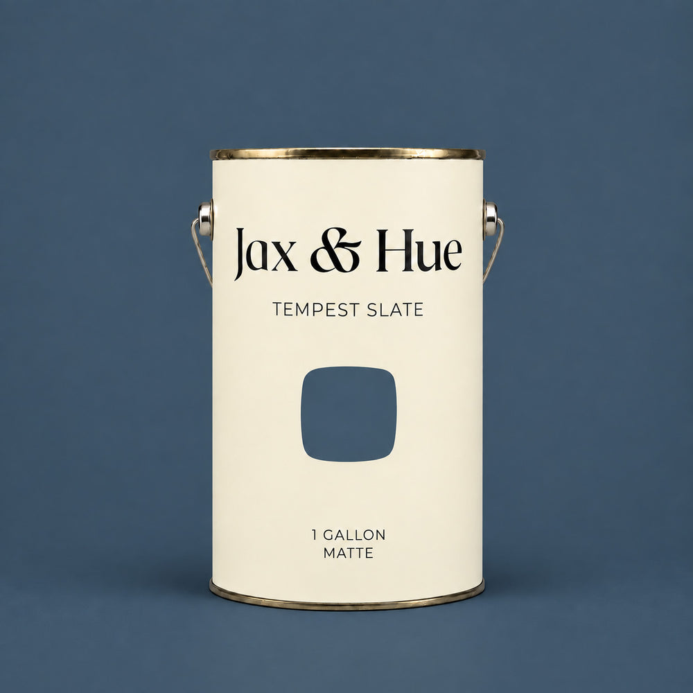 Jax & Hue Tempest Slate gallon of deep slate blue-gray interior paint against a matching backdrop