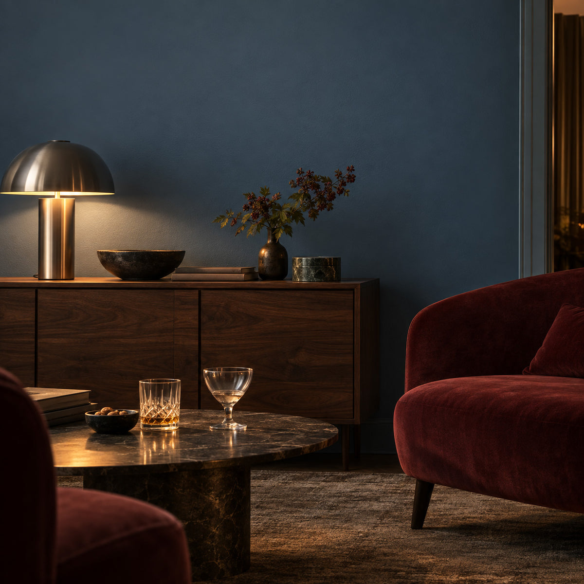 Tempest Slate deep blue-gray living room with a walnut sideboard, steel lamp, and oxblood seating