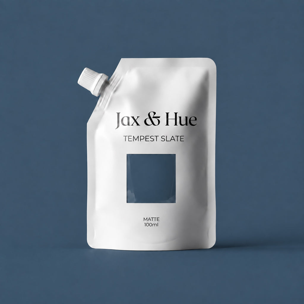 Jax & Hue Tempest Slate tester pouch of deep slate blue-gray interior paint against a matching backdrop