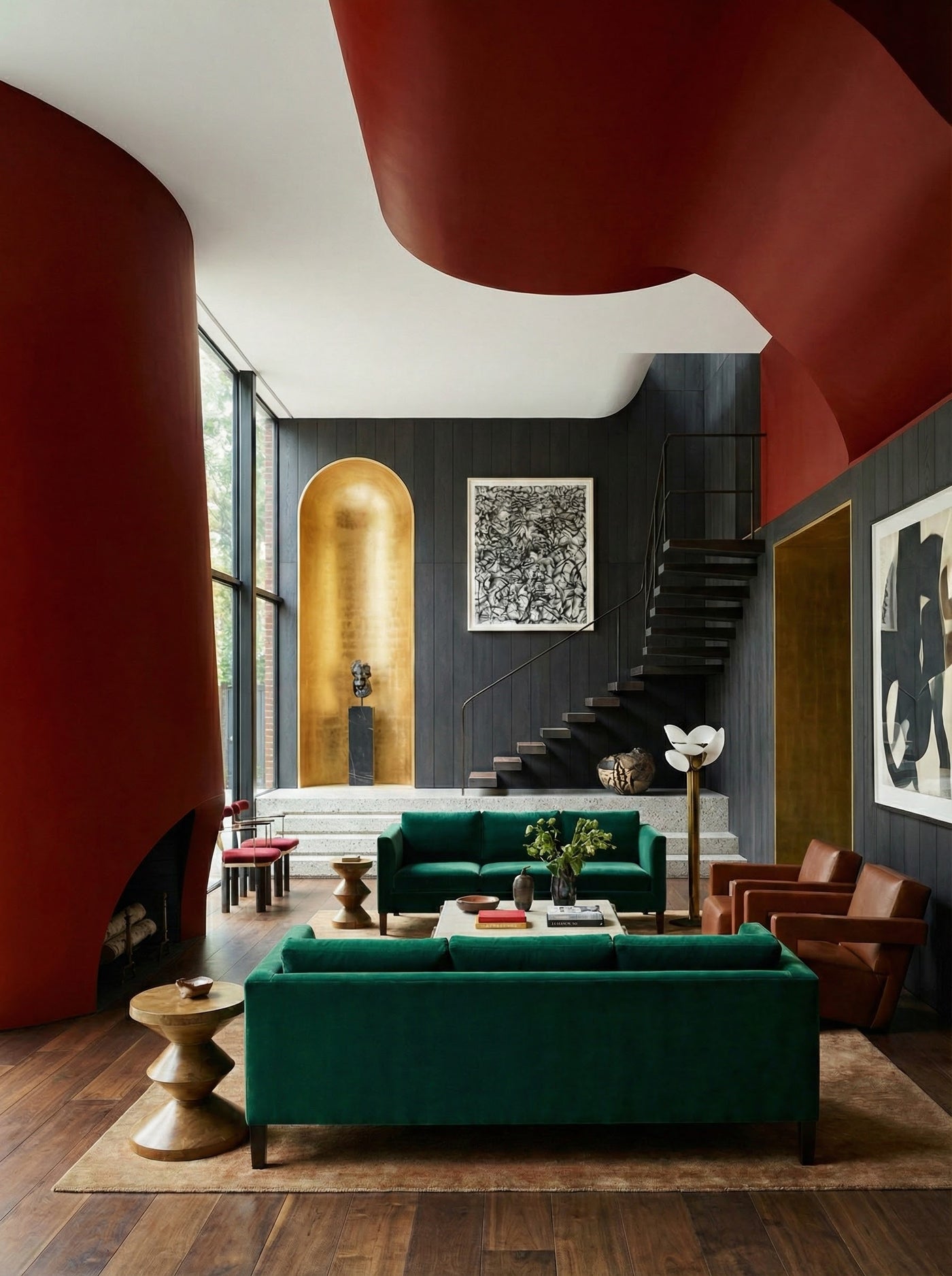 Modern living room with green sofas, wooden floor, and abstract art on walls.