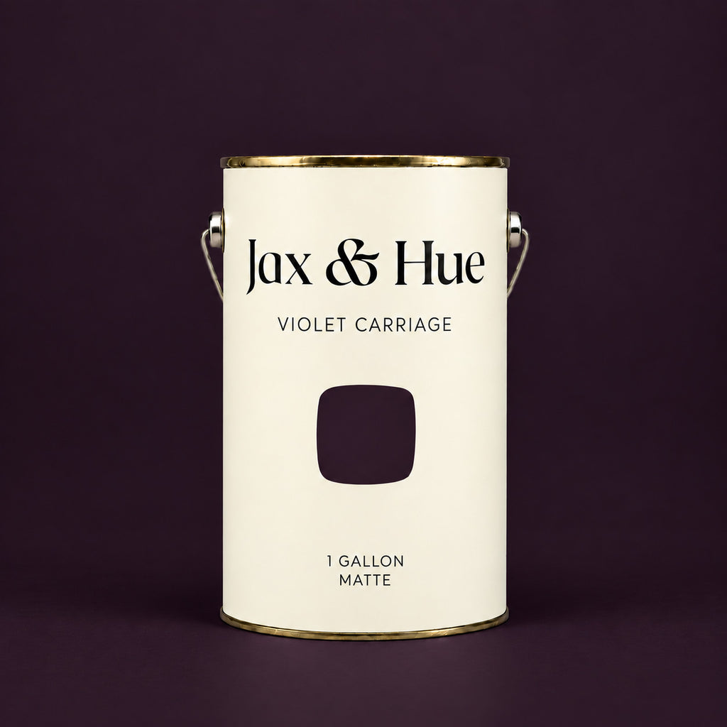 Jax & Hue Violet Carriage deep plum purple matte paint gallon on a matching dark plum background.
